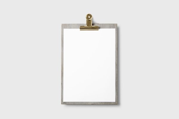 A blank clipboard on a gray background