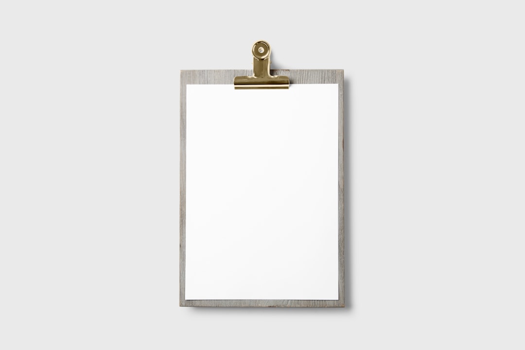 A blank clipboard on a gray background